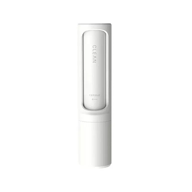 One white compact rotating pet-hair brush, closed, on a white background